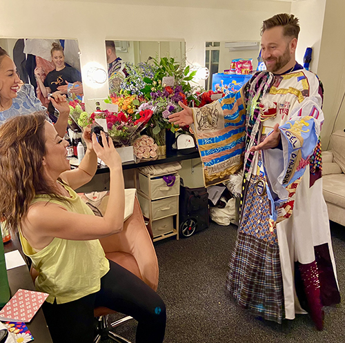 Leslie Rodriguez Kritzer captures Michael Fatica blessing her dressing room for her vlog.