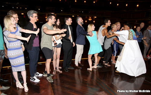 Justin Prescott does the ceremonial three laps around the stage. Photo by Walter McBride.