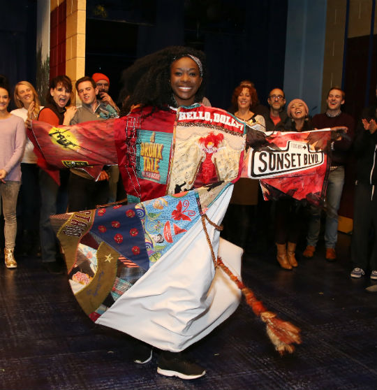 Mompoint poses with the Legacy Robe. Photo by Walter McBride.